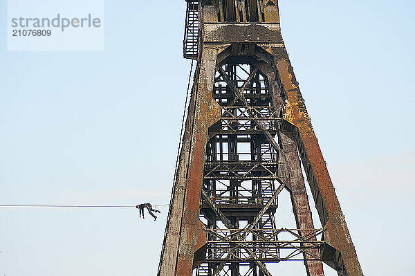 Highliner on tightrope on mine shaft tower  Charleroi  Wallonia  Belgium