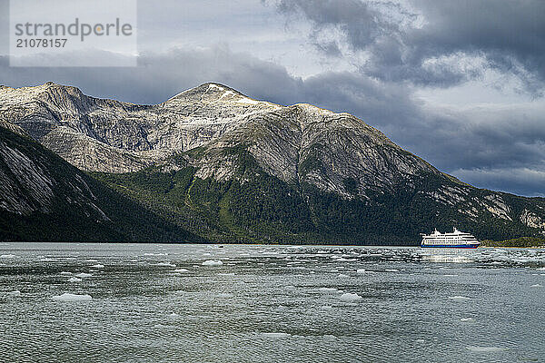 Cruise ship anchoring below Pia glacier  Tierra del Fuego  Chile  South America