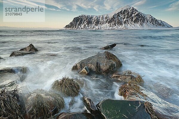 Long exposure  winter evening mood at Skagsanden  washed over stones  near Flakstad  Flakstadøy  Lofoten  Nordland  Norway  Europe