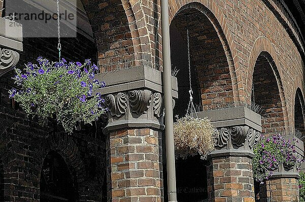 Brick arches with hanging plants and decorative flowers  traditional architecture  oslo  norway