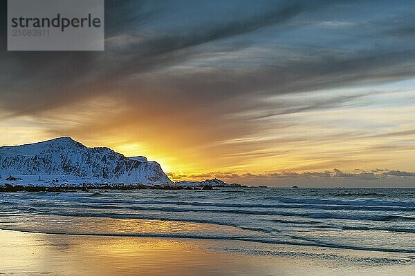 Sunset in winter at Skagsanden  stones on the beach at Flakstad  Flakstadøy  Lofoten  Nordland  Norway  Europe