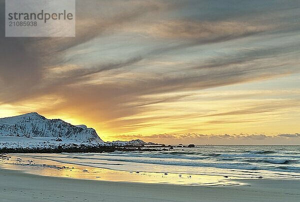 Sunset in winter at Skagsanden  stones on the beach at Flakstad  Flakstadøy  Lofoten  Nordland  Norway  Europe