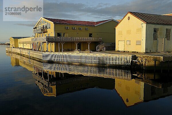 Wooden houses at the harbour in Andenes in the light of the midnight sun  Andöya  Vesteralen  Nordland  Norway  Europe