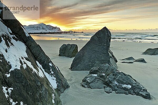 Sunset in winter at Skagsanden  stones on the beach at Flakstad  Flakstadøy  Lofoten  Nordland  Norway  Europe