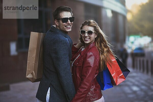 Picture showing young couple shopping in the city. Portrait of a couple with shopping bags in the city.People  sale  love and happiness concept