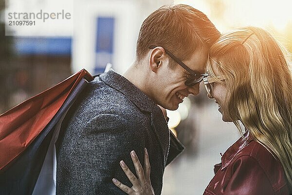 Picture showing young couple shopping in the city. Portrait of a couple with shopping bags in the city.People  sale  love and happiness concept