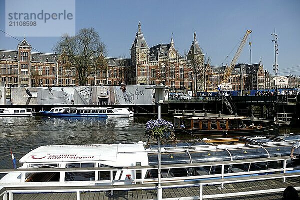 Sightseeing boats in front of Centraal Station in Amsterdam  Holland