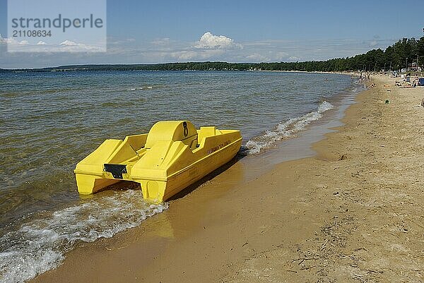 Yellow pedalo on the beach in Varamon  Motala  Sweden  Europe