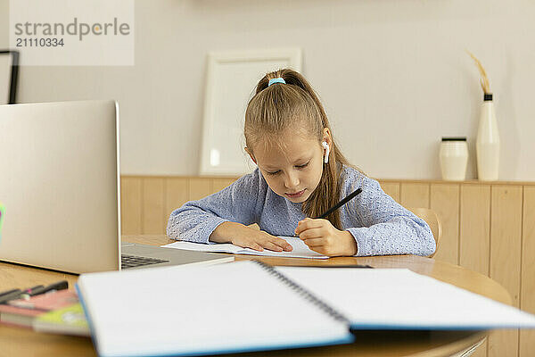 Girl doing homework at home