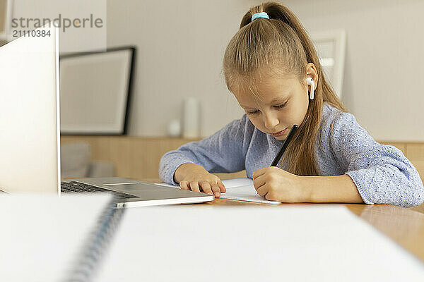 Cute girl doing study at home