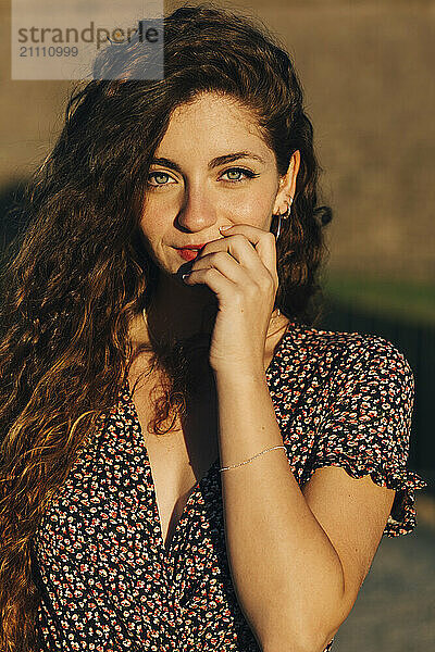 Beautiful woman in patterned dress during summer