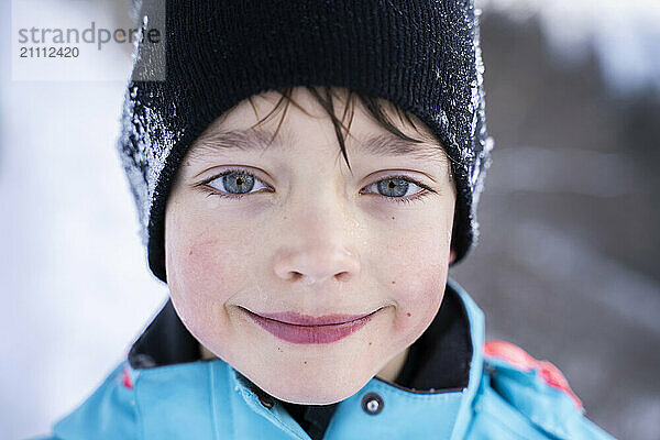 Smiling cute boy wearing knit hat