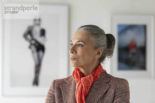 Senior woman wearing bandana in art museum