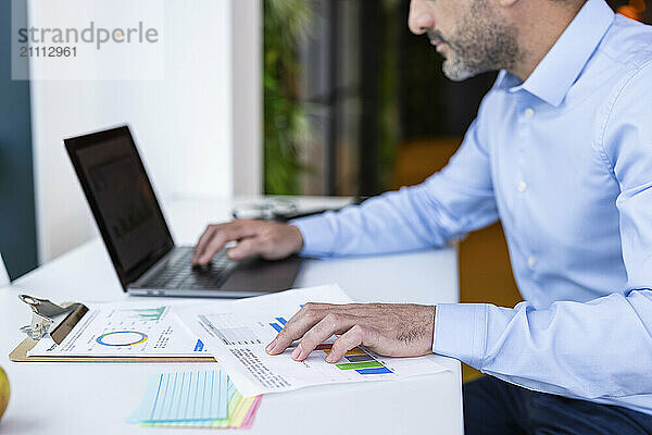 Businessman working with documents at co working space