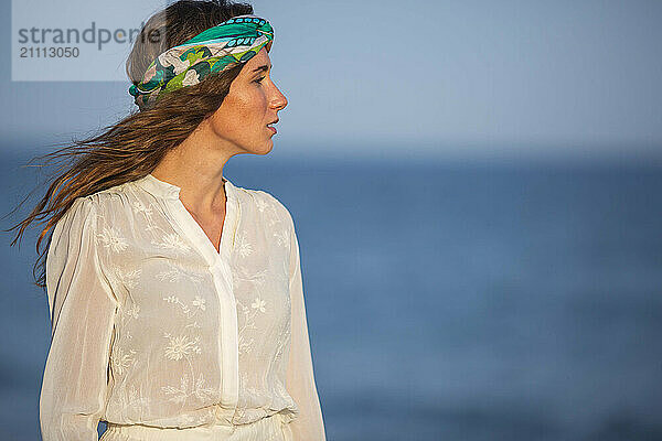 Thoughtful woman wearing headscarf