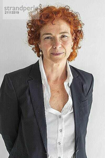 Redhead businesswoman against white background