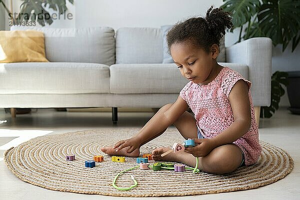 Girl playing with toys at home