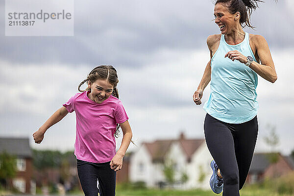 Happy daughter running with mother