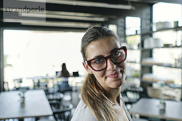 Portrait of pretty blonde wearing eyeglasses