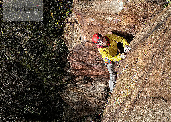 Mature man climbing North Berwick Law in Scotland