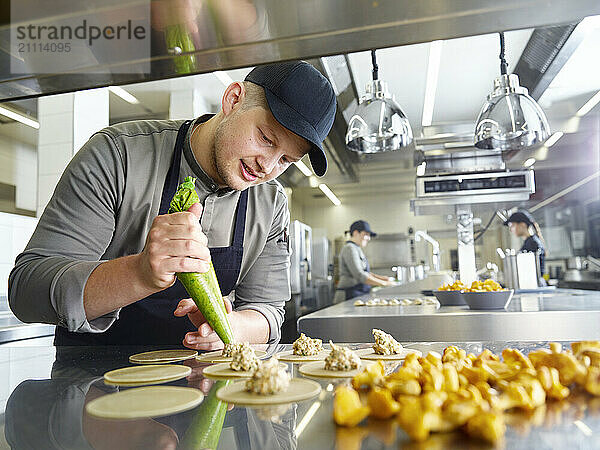 Chef preparing chinese dumplings in restaurant