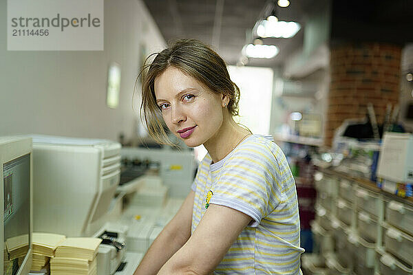 Woman near computer in a printing shop