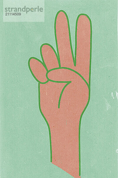 Hand with three fingers raised on green background