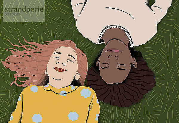 Two friends lying on the grass with heads together  smiling and enjoying a sunny day.