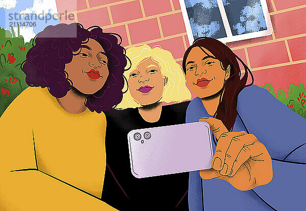 Three smiling women take a selfie together with a smartphone in front of a pink building with windows.