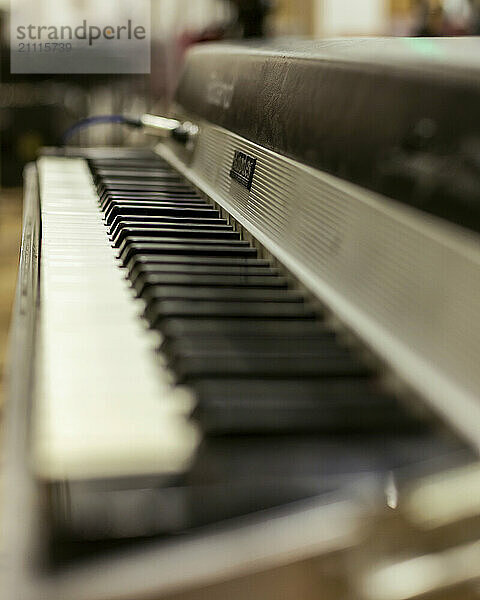 Close-up view of an electronic keyboard with shallow depth of field  focusing on the keys.