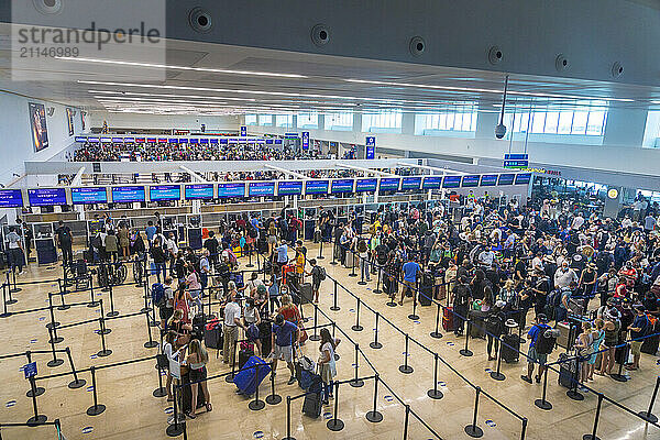 Mexico  Quintana Roo  Cancun Airport. Passengers in queues for check-in