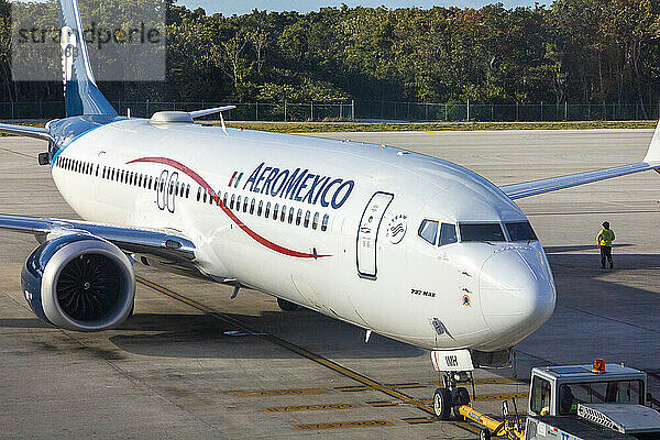 Mexico  Quintana Roo  Cancun Airport. Aeromexico airline plane. Passengers in queues for check-in