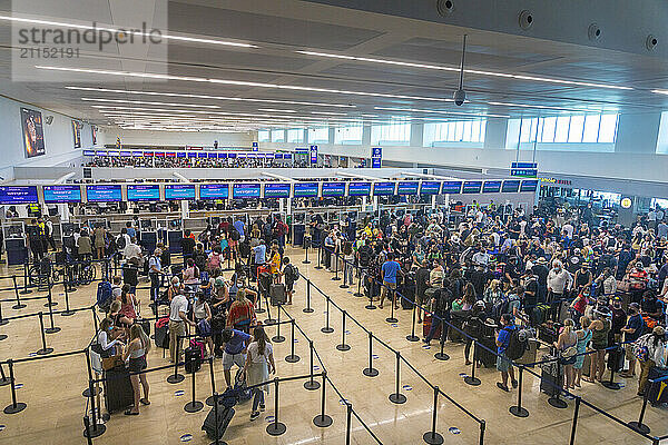 Mexico  Quintana Roo  Cancun Airport. Passengers in queues for check-in