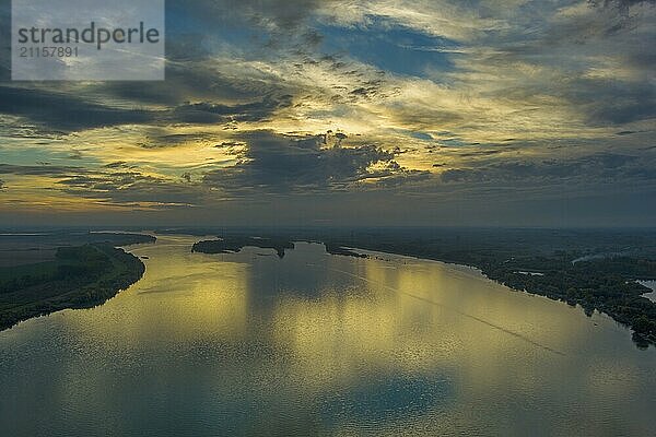 Aerial view landscpae with beautiful sunset with dramatic sky reflection on Danube river