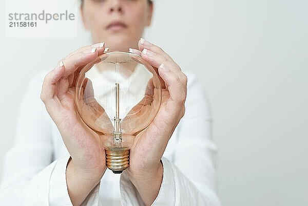 Lady Holding Lamp With Formal Outfit Presenting New Ideas For Project  Business Woman Showing Bulb With Two Hands Exhibiting New Technologies  Lightbulb Presenting Another Openion