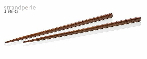 Two wooden chopsticks isolated on a white background