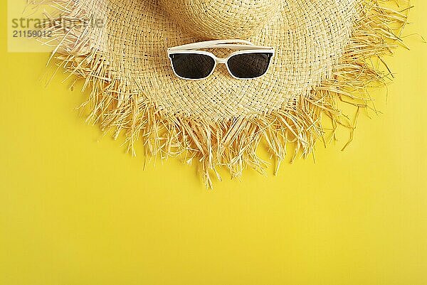 Sunglasses and straw hat on yellow background vacation travel planning mockup