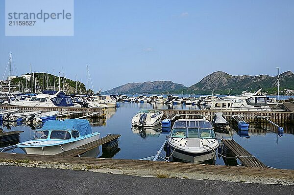 A quiet harbour with several sailing and motor boats  surrounded by Bergen  Sandnes  Fylke Rogaland  Norway  Europe