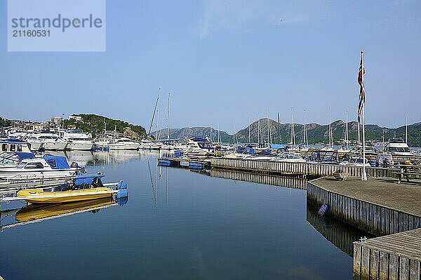 A quiet harbour with several sailing and motor boats  surrounded by Bergen  Sandnes  Fylke Rogaland  Norway  Europe