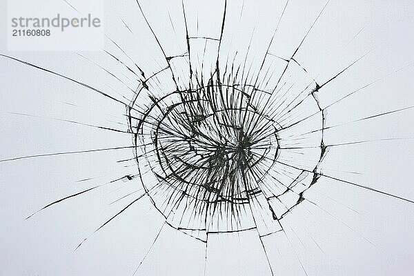 Broken glass texture on a white background. The protective glass of the phone is cracked from boredom. Cracks on damaged transparent material