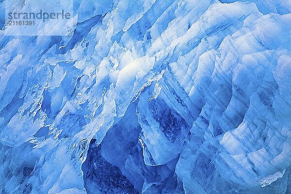 Blue ice patterns on a glacier wall in the arctic  Svalbard  Norway  Europe