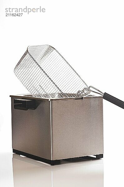 Stainless steel deep fryer on a white background