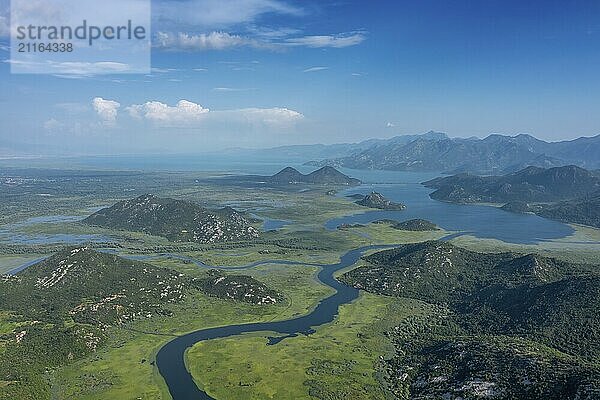 Aerial view of Rijeka Crnojevica  beautiful river between mountains flowing into Skadar Lake  Montenegro  Europe