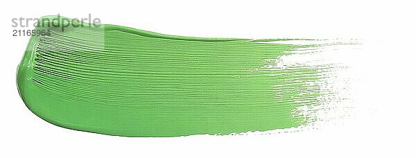 Green paint brush stroke isolated over the white background  top view