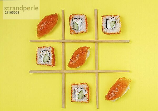 Food  Food  Creative Arrangement of Sushi and Sashimi on Yellow Background for Japanese Cuisine Concept