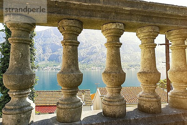 View on beautiful landscape of Perast through old columns