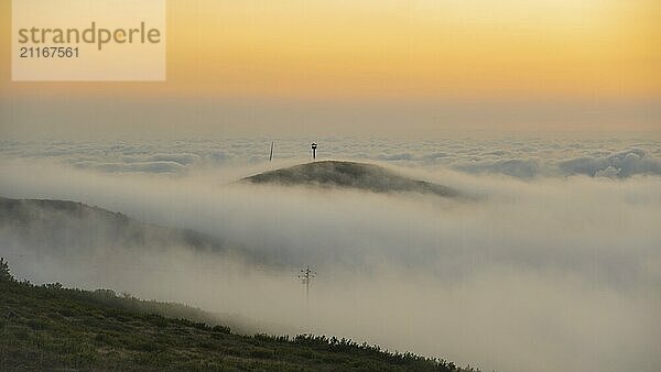 Sunset view on mountain Foia in Mochique  Portugal  during sunset with clouds rolling in and covering the peaks with fog  Europe