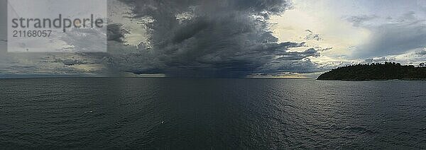 Aerial panorama landscape of sea and thunderstorm on horizon