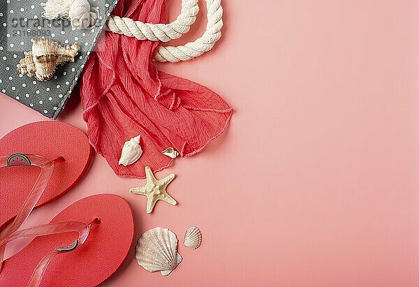 Flip flops and beach bag with shells and starfishes on pink background mockup