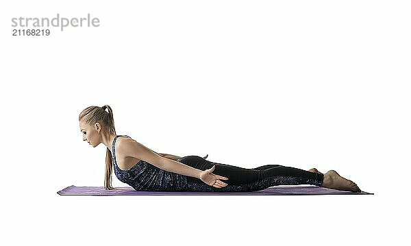 Young pretty girl doing sports exercises on a mat profile isolated view on white background